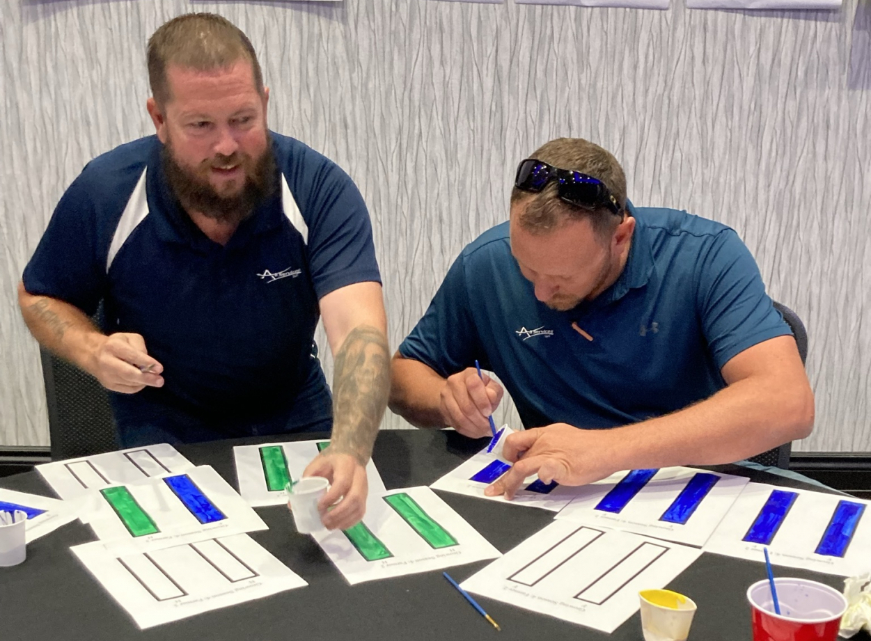 coop employees playing interactive learning game